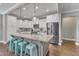 Modern kitchen with a large center island, barstool seating, and stainless steel appliances at 205 Virginia Water Dr, Rolesville, NC 27571
