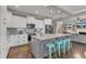 Well-designed kitchen with island seating that opens to the living room with fireplace feature at 205 Virginia Water Dr, Rolesville, NC 27571