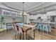 Open concept living with a view of the modern kitchen from the dining area at 205 Virginia Water Dr, Rolesville, NC 27571