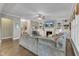 Large living room with fireplace, built-in shelving, and seamless flow to other living spaces at 205 Virginia Water Dr, Rolesville, NC 27571