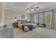 Serene main bedroom featuring neutral tones, tray ceiling, ample natural light, and carpet flooring at 205 Virginia Water Dr, Rolesville, NC 27571