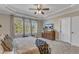 Bedroom features large windows, a dresser with a TV, and soothing neutral colors at 205 Virginia Water Dr, Rolesville, NC 27571
