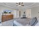 Well-lit main bedroom with trey ceilings, ceiling fan, furniture and ensuite bathroom at 205 Virginia Water Dr, Rolesville, NC 27571