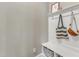 Mudroom with built-in bench seating, storage cubbies below, and hooks for hanging items at 205 Virginia Water Dr, Rolesville, NC 27571