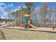 The colorful community playground offers a safe and fun play area for children at 205 Virginia Water Dr, Rolesville, NC 27571