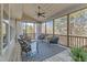 Inviting screened porch with comfortable seating and scenic outdoor views with light blue accents at 205 Virginia Water Dr, Rolesville, NC 27571