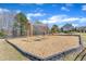 Community swings surrounded by woodchips and a black boarder on a sunny day at 205 Virginia Water Dr, Rolesville, NC 27571