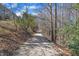 View of walking trail near homes on a sunny day with blue sky at 205 Virginia Water Dr, Rolesville, NC 27571