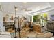 Art studio with an easel, art supplies, and a large window overlooking the greenery outside at 2140 N Lakeshore Dr, Chapel Hill, NC 27514