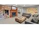 Finished basement featuring brick fireplace and a comfortable seating area for relaxation at 2140 N Lakeshore Dr, Chapel Hill, NC 27514
