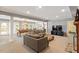Finished basement with neutral carpet features a pool table, TV, and comfortable sofa at 2140 N Lakeshore Dr, Chapel Hill, NC 27514