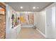Finished basement hallway with neutral walls, recessed lighting, carpet floors, and artistic decor at 2140 N Lakeshore Dr, Chapel Hill, NC 27514