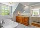 Bright bathroom with a classic clawfoot tub, custom vanity, and elegant fixtures at 2140 N Lakeshore Dr, Chapel Hill, NC 27514
