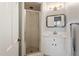 Bathroom featuring a shower, a white vanity, mirror, and a towel rack at 2140 N Lakeshore Dr, Chapel Hill, NC 27514
