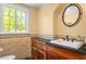 Charming bathroom with granite counters, tile backsplash and floor, and a large window at 2140 N Lakeshore Dr, Chapel Hill, NC 27514