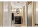 Bathroom featuring a shower, a dark wood vanity, and decorative mirror and lights at 2140 N Lakeshore Dr, Chapel Hill, NC 27514