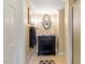 Bathroom with an oval mirror, a cabinet style vanity, and sconce lighting at 2140 N Lakeshore Dr, Chapel Hill, NC 27514
