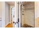 Modern glass shower with tiled walls and custom niche; access to hall at 2140 N Lakeshore Dr, Chapel Hill, NC 27514