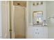 Bathroom with a shower, vanity with sink, and a framed mirror with lighting at 2140 N Lakeshore Dr, Chapel Hill, NC 27514