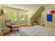 Bedroom with hardwood floors, natural light, and accent furniture at 2140 N Lakeshore Dr, Chapel Hill, NC 27514