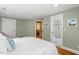 Serene bedroom with en suite bathroom and ample natural light, featuring clean and inviting design at 2140 N Lakeshore Dr, Chapel Hill, NC 27514