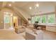Bonus room with plenty of natural light, neutral colors, and built-in shelves at 2140 N Lakeshore Dr, Chapel Hill, NC 27514