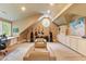 Bonus room featuring guitars, neutral colors, natural light, and built-in shelves at 2140 N Lakeshore Dr, Chapel Hill, NC 27514