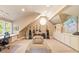 Spacious bonus room with built-in shelving, seating, guitars and natural light at 2140 N Lakeshore Dr, Chapel Hill, NC 27514