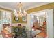 Dining room with clear glass table and views to the living room at 2140 N Lakeshore Dr, Chapel Hill, NC 27514
