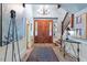 Stately foyer with hardwood floors, high ceilings and a chandelier at 2140 N Lakeshore Dr, Chapel Hill, NC 27514