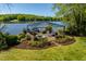 View of lakefront gazebo showing outdoor seating and lake view at 2140 N Lakeshore Dr, Chapel Hill, NC 27514