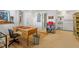 Office area with a wooden desk, built-in shelves, and an additional kitchen area at 2140 N Lakeshore Dr, Chapel Hill, NC 27514
