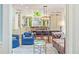 Open-concept kitchen and living space features a large dining table, modern lighting, and stylish seating at 2140 N Lakeshore Dr, Chapel Hill, NC 27514