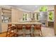 Gourmet kitchen with granite counters, stainless steel appliances, and a breakfast bar at 2140 N Lakeshore Dr, Chapel Hill, NC 27514