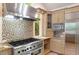 Kitchen featuring granite counters, stainless steel appliances, and a professional-grade range at 2140 N Lakeshore Dr, Chapel Hill, NC 27514