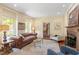 Comfortable living room showcasing hardwood floors, fireplace, and staircase access at 2140 N Lakeshore Dr, Chapel Hill, NC 27514
