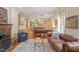 Open-concept living space with fireplace, wood floors, and an eat-in kitchen and dining area at 2140 N Lakeshore Dr, Chapel Hill, NC 27514