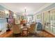 Elegant living room with fireplace, chandelier, and classic furnishings at 2140 N Lakeshore Dr, Chapel Hill, NC 27514