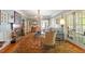 Bright and inviting living room with a fireplace, chandelier, and hardwood floors at 2140 N Lakeshore Dr, Chapel Hill, NC 27514