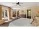 Spacious bedroom with a king bed and door to the balcony, plus a walk-in closet and ensuite bathroom at 2140 N Lakeshore Dr, Chapel Hill, NC 27514