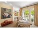 Sitting area leading to a balcony with a lounge chair and accent decor at 2140 N Lakeshore Dr, Chapel Hill, NC 27514