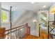 Stairwell with iron railing and hardwood steps at 2140 N Lakeshore Dr, Chapel Hill, NC 27514