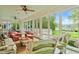 Bright sunroom with lots of windows and views of the backyard and lake at 2140 N Lakeshore Dr, Chapel Hill, NC 27514