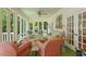 Cozy sunroom with comfortable seating, natural light, and serene views at 2140 N Lakeshore Dr, Chapel Hill, NC 27514