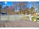 Back deck overlooking a sprawling green lawn with mature trees at 2246 Arrowhead Rd, Dunn, NC 28334
