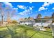 Expansive backyard with a charming screened-in porch, stone patio, lush lawn, and mature trees for outdoor enjoyment at 2246 Arrowhead Rd, Dunn, NC 28334