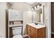 Bathroom featuring a vanity with storage and an enclosed toilet at 2246 Arrowhead Rd, Dunn, NC 28334
