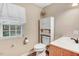 Bathroom featuring a window for natural light and wood-style flooring at 2246 Arrowhead Rd, Dunn, NC 28334