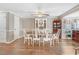 Charming dining area with hardwood floors, white chairs, and a cozy atmosphere at 2246 Arrowhead Rd, Dunn, NC 28334