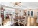 Elegant dining room with hardwood floors, stylish seating, and large windows at 2246 Arrowhead Rd, Dunn, NC 28334